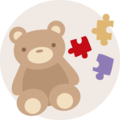Een schattige bruine teddybeer met kleurrijke puzzelstukjes daarnaast.